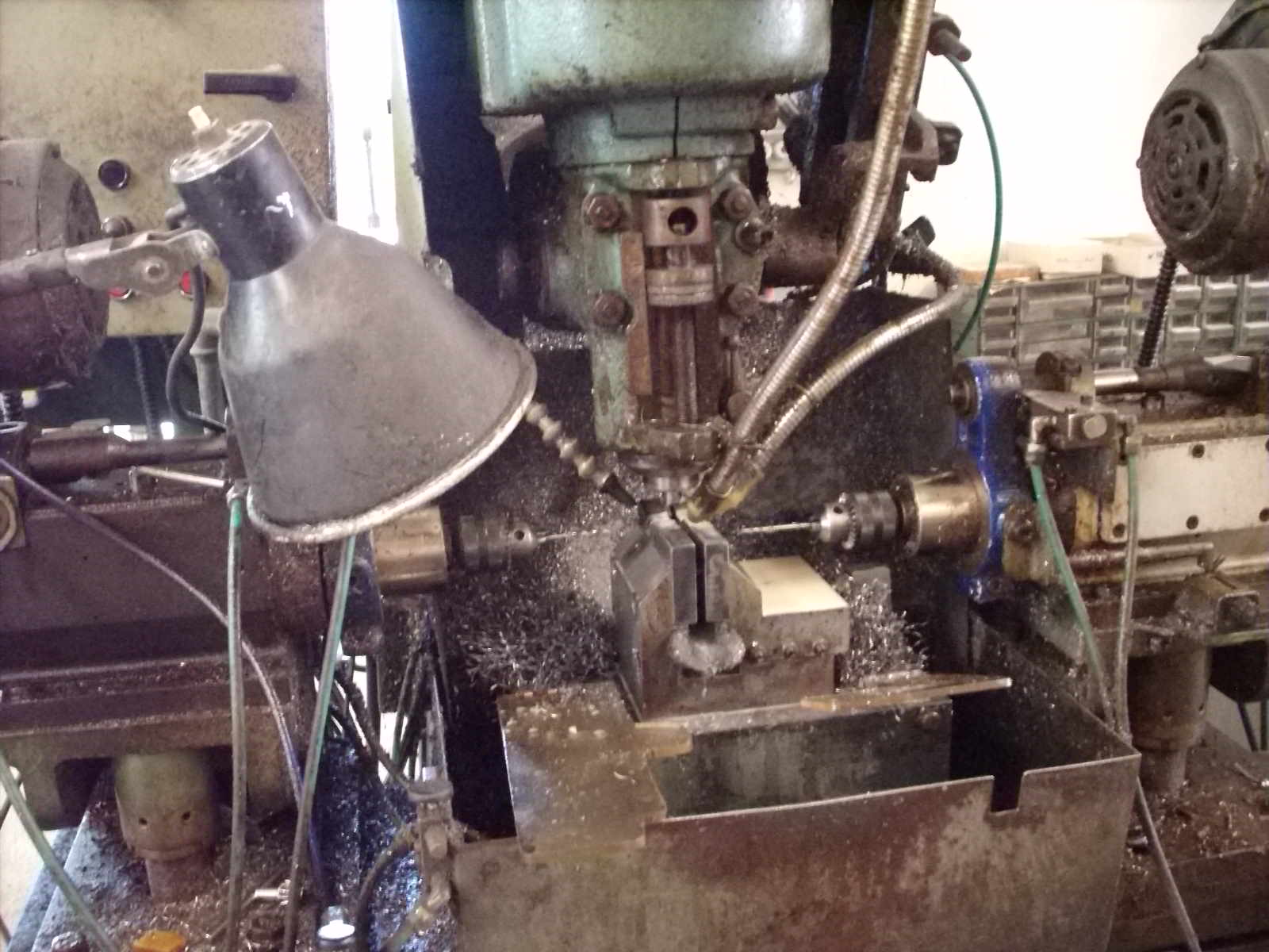 Not quite sure what all this machine did. Cut and drilled several places at once.