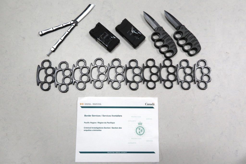 Weapons seized by the CBSA’s Criminal Investigations Section (from left to right seized goods: Butterfly knife, two stun guns, two brass knuckle knives, ten brass knuckles). CBSA photo.<br />B.C. man gets 18 months in jail for smuggling switchblades, butterfly knives<br />Richmond’s Gerald Allan Martin pleaded guilty to numerous weapons charges in October 2017<br />ASHLEY WADHWANIMay. 15, 2018 4:25 p.m.NEWS